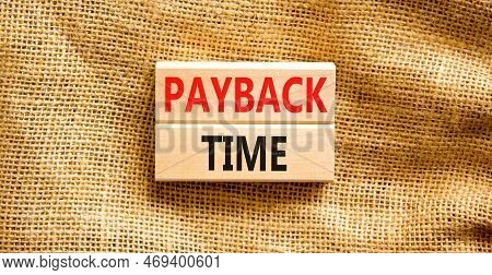 Payback Time Symbol. Concept Words Payback Time On Wooden Blocks. Beautiful Canvas Table Canvas Back