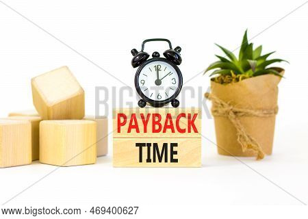 Payback Time Symbol. Concept Words Payback Time On Wooden Blocks. Beautiful White Table White Backgr