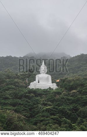 White Buddha Statue On The Mountain In Wat Thep Phithak Punnaram Temple Nakhon Ratchasima.