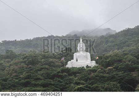 White Buddha Statue On The Mountain In Wat Thep Phithak Punnaram Temple Nakhon Ratchasima.