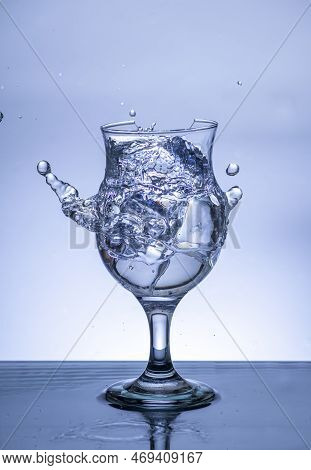 The Image Of Pouring Drinking Water, Into A Broken Glass, That Makes One Feel Refreshed On Blurred W