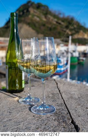 Tasting Of Txakoli Or Chacolí Slightly Sparkling Very Dry White Wine Produced In Spanish Basque Coun