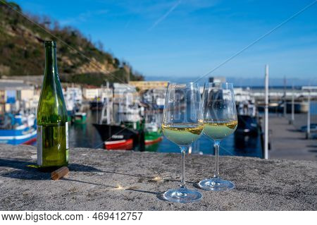 Tasting Of Txakoli Or Chacolí Slightly Sparkling Very Dry White Wine Produced In Spanish Basque Coun