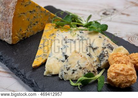 Tasting Of English Cheeses Blue Stilton And Blue Shropshire Close Up