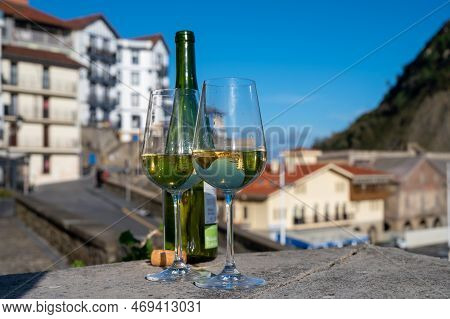 Tasting Of Txakoli Or Chacolí Slightly Sparkling Very Dry White Wine Produced In Spanish Basque Coun