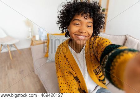 Happy African American Teen Girl Blogger Smiling Face Talking To Webcam Recording Vlog. Social Media