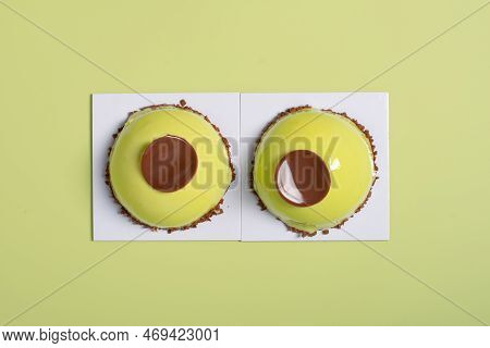 Two Mousse Green Cakes Decorated With Chokolade, Sweet Dessert Top View