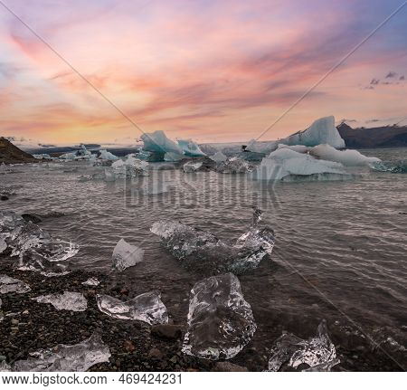 Jokulsarlon Glacial Lake, Lagoon With Ice Blocks, Iceland. Situated Near The Edge Of The Atlantic Oc