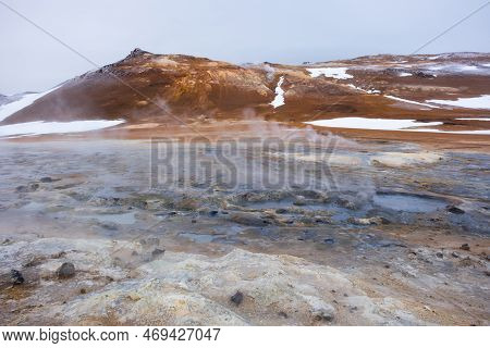 Geothermal Area In Iceland. Smoking Fumaroles. Real Volcanic Activity. Evaporating Water. Hverir