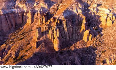 Colourful Mountains. Red And Pink Valley At Sunset. Tourist Attractions Goreme, Cappadocia, Turkey.