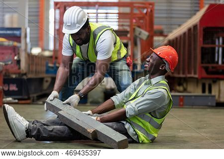 Industrial Accident Concept. Male African American Accidents From Working Carrying Heavy Objects On 