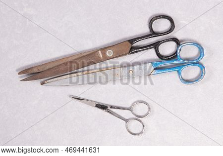 Rusty Old Scisors Isolated On A Grey Background