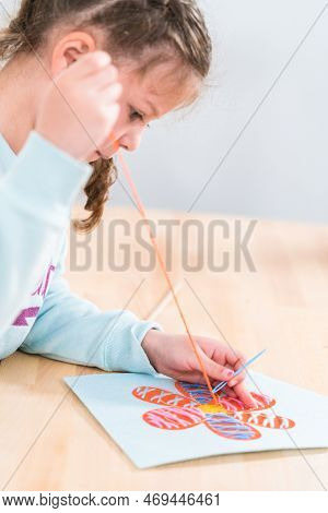 Little Girl Learning How To Sew With Sewing Craft Kit For Kids.