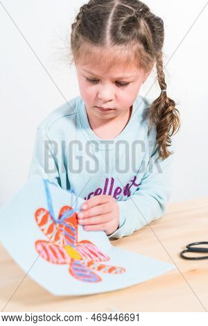 Little Girl Learning How To Sew With Sewing Craft Kit For Kids.