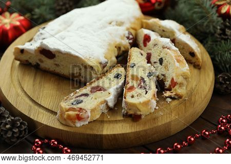 Traditional Stollen With Decoration On Wooden Background