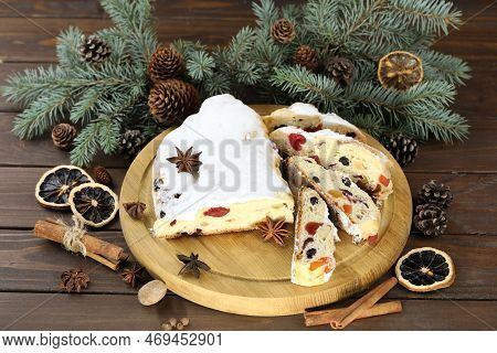 Traditional Stollen With Decoration On Wooden Background