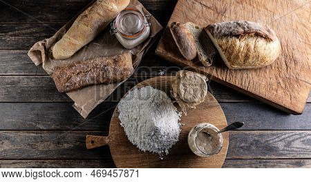 Bakery Concept, Flour Bread And Glasses With Rye Sourdough On The Table. - Top Of View
