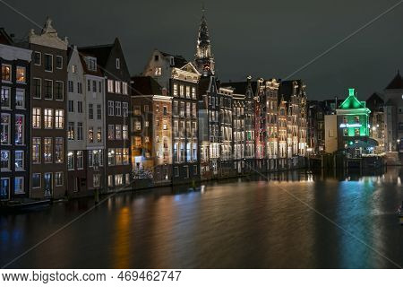 City Scenic From Amsterdam At The Damrak In The Netherlands At Night