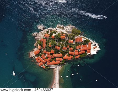 Aerophotography. Aerial View Of Sveti Stefan Island In A Beautiful Summer Day, Montenegro From Flyin