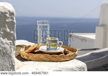 Cup With Aromatic, Hot, Tasty Coffee In A Cup And Biscuit  On A Tray Close-up In The Patio Overlooki