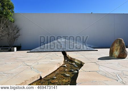 Costa Mesa, California - 24 Jan 2023: The Noguchi Garden, Closeup Of Water Use, A Granite Wedge And 