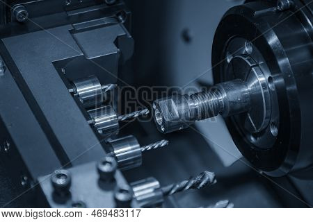The  Multi Tasking Cnc Lathe Machine  Drilling The Brass Shaft Parts. The Hi-technology Metal Workin