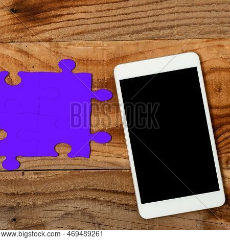 Mobile Phone With Important Message On Desk With Empty Purple Puzzels And Notes. Cellphone Screen Wi