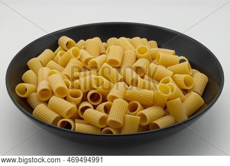 Raw Mezze Maniche Rigate, Italian Pasta. Mezze Maniche Rigate Are Ideal For Serving With Meat Or Fis