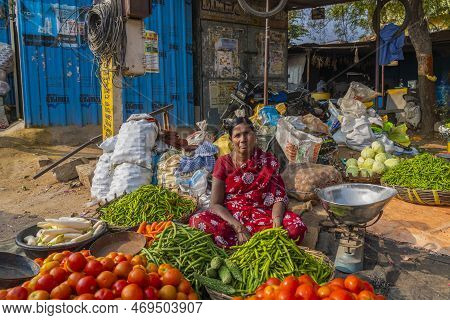 Puttaparthi, Andra Pradesh - India - January 21.2023: A Women Selling Vegetables On The Local Indian