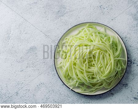 Zucchini Noodles On Plate. Vegetable Noodles - Green Zoodles Or Courgette Spaghetti On Plate Over Gr