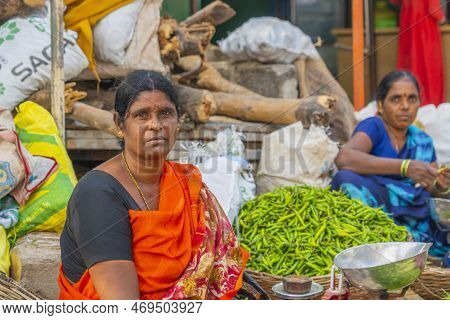 Puttaparthi, Andra Pradesh - India - January 21.2023: A Women Selling Vegetables On The Local Indian