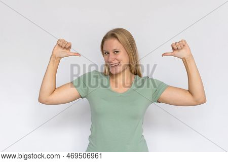 Excited Young Woman Pointing Thumbs At Herself. Portrait Of Proud Caucasian Female Model With Fair H