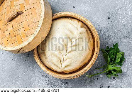 Pyanse Steamed Bun In A Bamboo Steamer, Korean Street Food. Gray Background. Top View