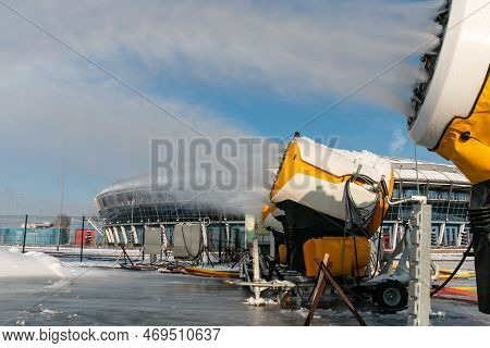 Snow Cannons Spray Artificial Snow Crystals. Snow Guns. Production Of Artificial Snow. Cars Make Sno