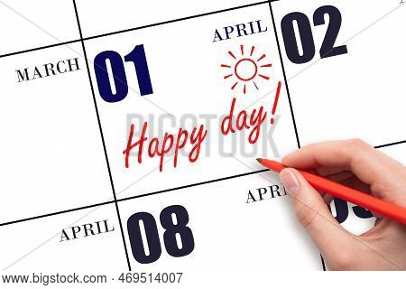 1st Day Of April.  Hand Writing The Text Happy Day And Drawing The Sun On The Calendar Date April 1.