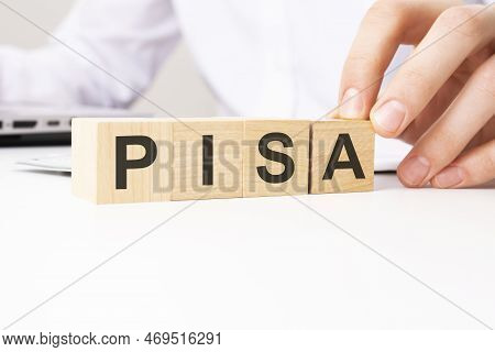 Pisa - Programme For International Student Assessment - Acronym On Wooden Cubes On A White Backgroun