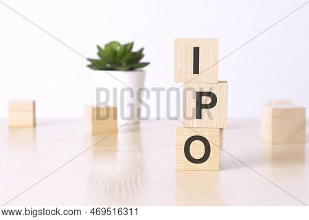 Ipo - Initial Public Offering - Text On Wooden Cubes On A White Background