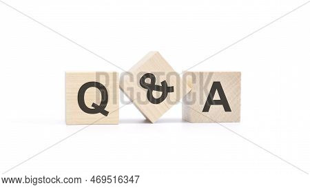 Q And A - Acronym From Wooden Blocks With Letters, Question And Answer Concept, Top View On White Ba