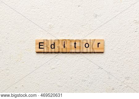 Editor Word Written On Wood Block. Editor Text On Table, Concept.