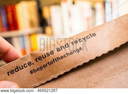 Paris, France - Dec 2, 2022: Close-up Male Hand Holding Parcel Package With Massimo Dutti Fashion Cl
