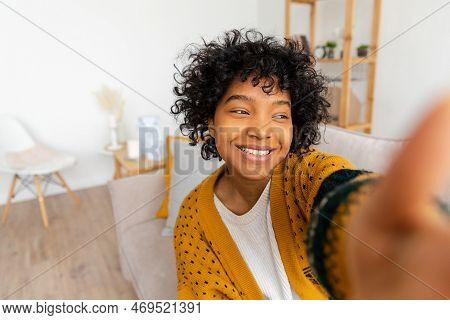 Happy African American Teen Girl Blogger Smiling Face Talking To Webcam Recording Vlog. Social Media