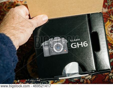 Paris, France - Dec 2, 2022: New Panasonic Lumix Gh6 Mirrorless Camera Package In Male Hand During F