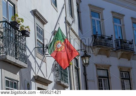 Developing Portuguese Flag On The Building. The Flag Of Portugal.