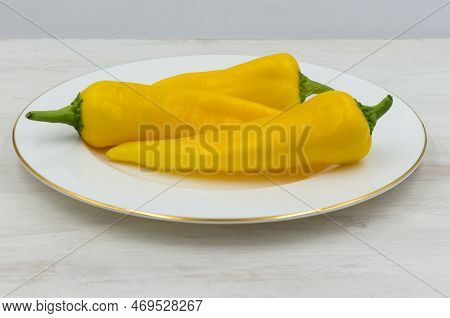 Yellow Ramiro Pepper Is Prepared For Use In The Preparation Of A Salad Or Other Dish. Three Beautifu