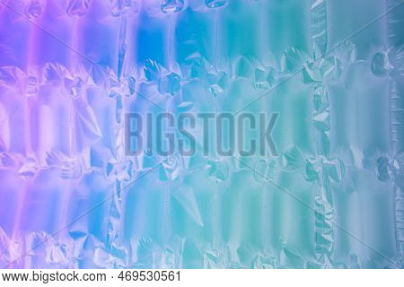 Background For Design. Textured Wrap For The Safe Packaging Of Fragile Parcels With A Neon Gradient.