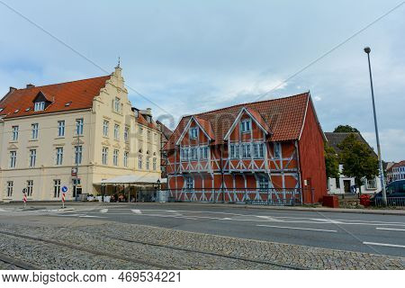 Red Half-timbered House And A Yellow House On A Street In The Historic Hanseatic City Of Wismar, On 