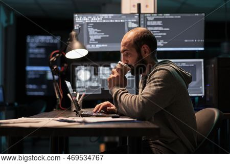 It Developer Drinking Coffee Cup And Programming Html Script In Office After Hours, Enjoying Caffein