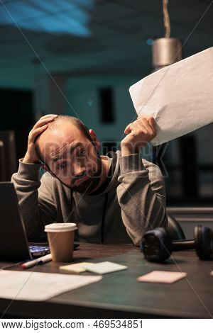 Exhausted Overworked Engineer Programming Html Code On Laptop And Multiple Monitors, Working Under S