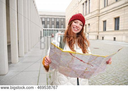 Redhead Girl, Tourist Explores City, Looks At Paper Map To Find Way For Historical Landmarks, Woman 
