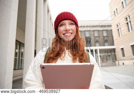 Stylish Ginger Girl, Tourist Walks With Digital Tablet Around City, Woman Connects To Iternet On Her